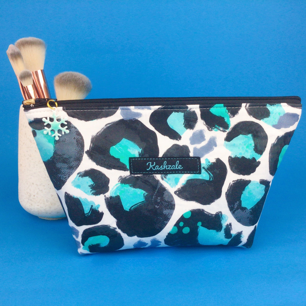 Snow Leopard Medium Cosmetic Bag. Kasey Rainbow Design.