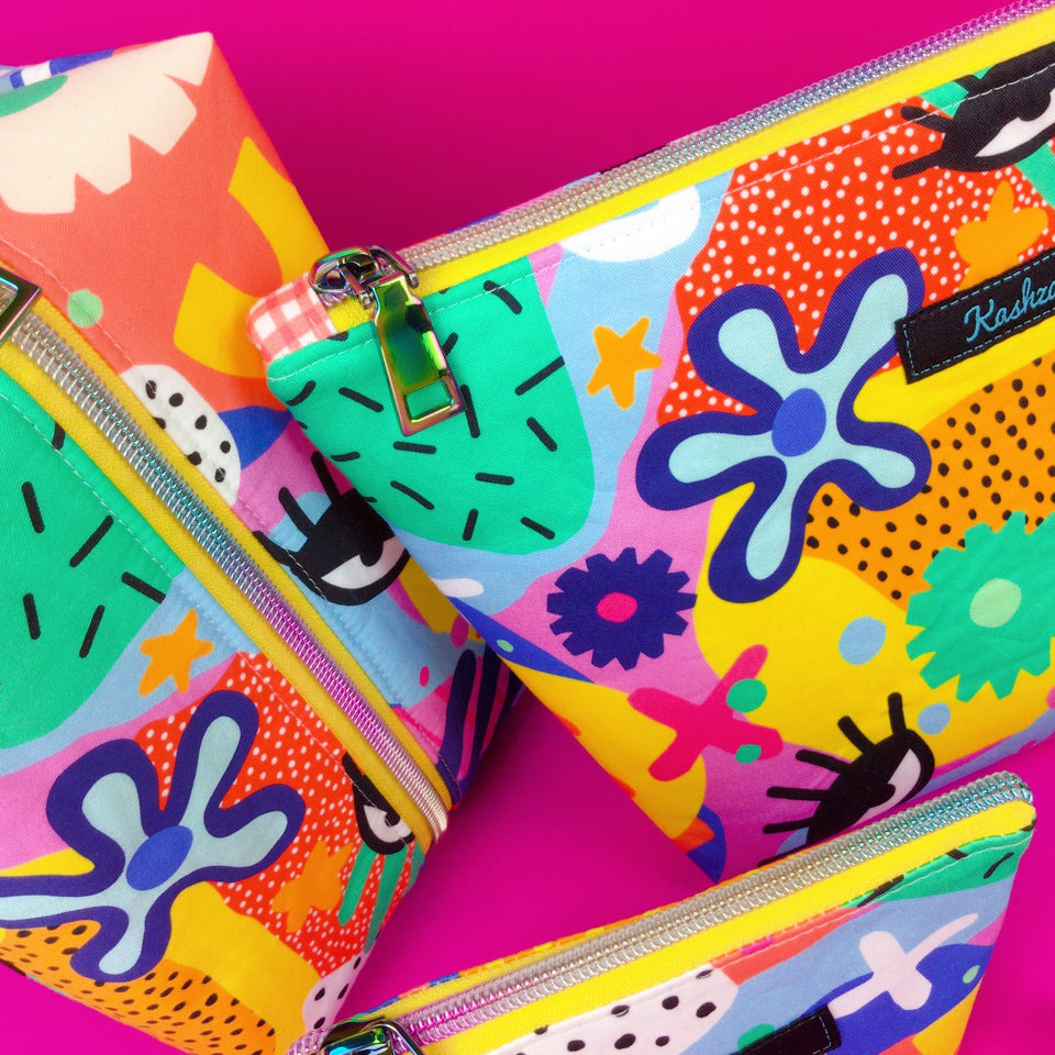 A collection of brightly coloured cosmetic bags