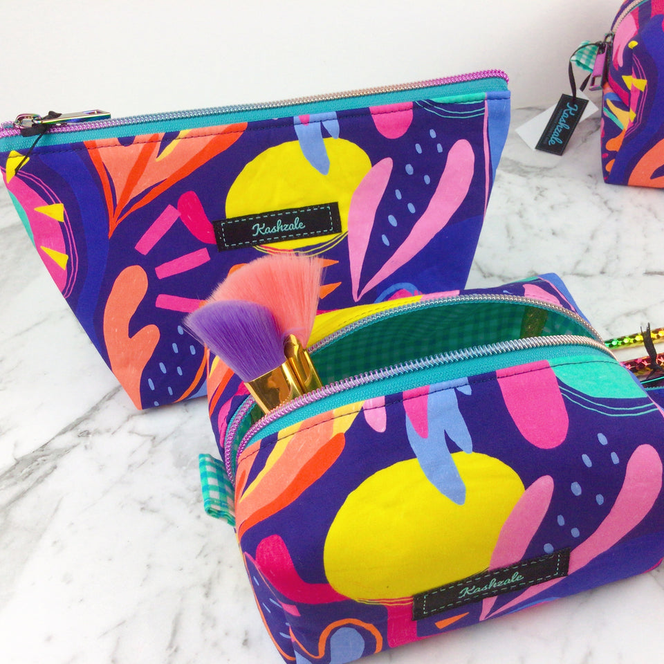 Image of brightly coloured cosmetic bags in abstract design.